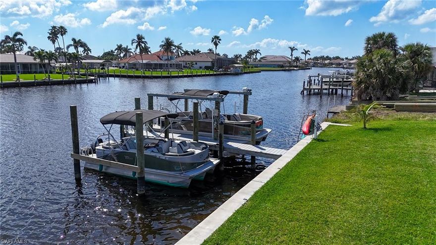 Location, Location, Water view! Currently room for two boats 38 feet or longer. One lift kept and one in the water at the pier. More dockage could be added.  This extremely well maintained duplex has an absolutely stunning South, Southwest view looking out over a 200 foot canal. The gulf access in Cape Coral doesn’t get better than this. Approx. 10 minutes idle to the river and 5 miles to open water! Spend your days relaxing on the almost 1,000 sq ft covered back porches.  Each unit has an under-truss bonus room added in the front that is under air and boasts an additional 320 sq ft.  The structure and landscaping has been meticulously maintained by the owner occupants. New roof placed in 2012, New A/C on right unit in 2018, left unit 2009. All new tile floors, new bathrooms and kitchens. Come see this piece of paradise that is primed to be a timeless investment located just down from the Bimini Basin and Four Freedoms park. An investor could collect rent on both sides or live in one, rent the other,  and park two or more 38 foot plus cigarette or large center consoles It is a must see in person. Covered parking for up to 4 vehicles.