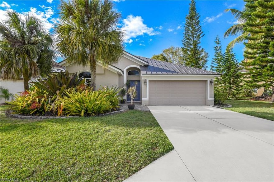 COMPLETELY RENOVATED lakefront home! Enjoy living in one of SWFL's highly desired gated communities that is less than 5 miles from Vanderbilt Beach, 3 miles from the great shopping & dining of MERCATO, and only 10 miles from the WORLD FAMOUS Naples 5th Ave. This single family home offers a unique & comfortable layout w/ living and family room design, formal dining area, split bedroom floor plan, cathedral & vaulted ceilings, open concept kitchen w/ island & breakfast nook, stacked washer & dryer in laundry room, 2-car garage, and long screened lanai overlooking the lake. Renovated w/ class- contemporary light fixtures & hardware, stainless steel appliances, quartz countertops in kitchen & baths, and luxury plank flooring throughout. Brand new air conditioning system/ handler and compressor, brand new plumbing throughout (all permitted), and brand new metal roof! Orchards is a gated & deeded community offering a lakefront community pool, playground, basketball court, bocce ball, tennis & pickleball courts. This home is right across the street from the pool, playground and all of the activities!