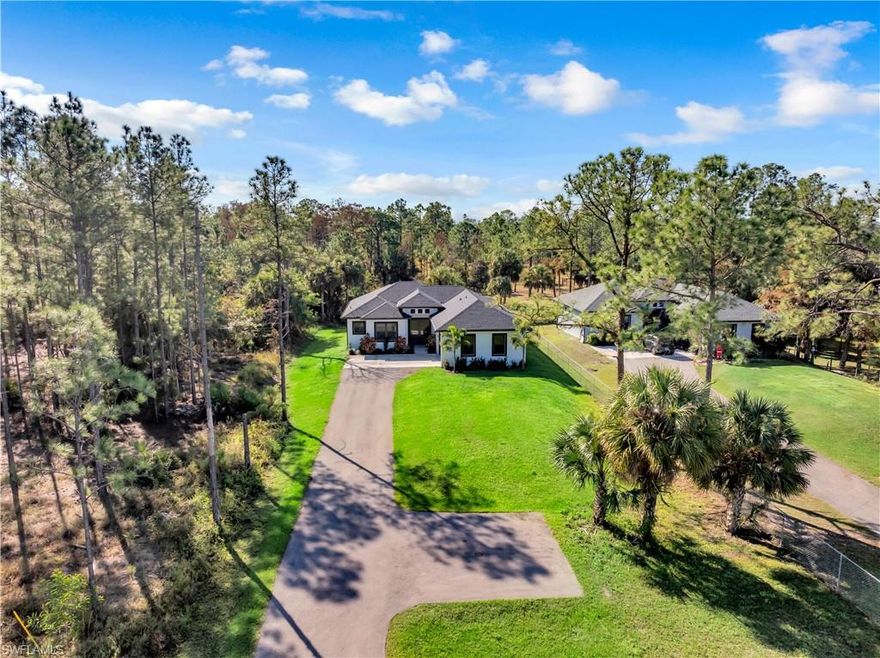 Welcome to this stunning 3 bedroom, 2 bath home with a den, perfectly situated on 1.14 acres in Naples. Barely lived in and truly move-in ready, this home offers high ceilings, elegant tile flooring throughout, and modern quartz countertops that bring both style and functionality to the kitchen.
Designed for comfort and peace of mind, the property features impact windows and doors throughout. The spacious open layout flows seamlessly to a huge covered back porch, complete with an outdoor sink and ready for you to add a grill ideal for entertaining and outdoor living.
With over an acre of land, there’s plenty of space to create the lifestyle you want, whether that’s a pool, garden, workshop, or simply enjoying privacy and open space. This beautiful home needs nothing and is ready for its new owners to make it their own.
PID 39898000005