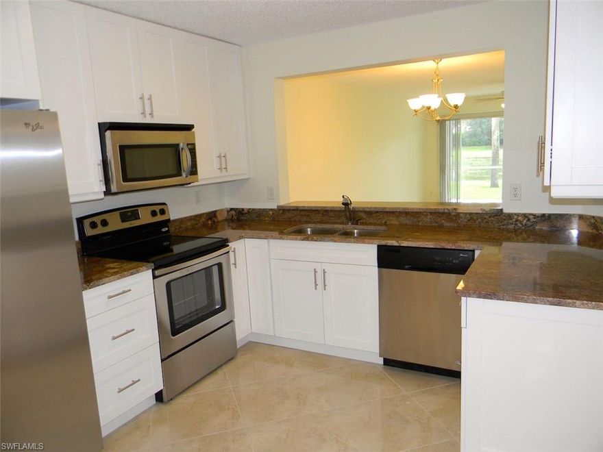 This completely remodeled 1st floor end unit condo in the Newcastle section of Berkshire Lakes is only minutes to downtown Naples 5th Ave., the white sandy beaches, and I-75 access. It is also located within walking distance to the Berkshire Commons plaza featuring Publix grocery store, Walgreens, Banks, Gas Station, and lots of dining and retail shops! 3 Bedrooms, 2 Baths, 1450 sqft, under air and it comes with a carport too! This unit has been completely remodeled featuring brand new 42" wood cabinets with soft closing drawers, granite counters, stainless steel appliances, and porcelain tile floors throughout. Both bathrooms have also been extensively remodeled as well, and the Master Bathroom features a seamless glass shower door. All appliances including the washer and dryer are brand new, and there are fans with lights in all rooms. Dining options are a breakfast nook in the kitchen area, breakfast bar and dining-living room. The screened-in lanai floor has been tiled too for easy maintenance and an upscale look! Don't miss this unit as it will go quickly.