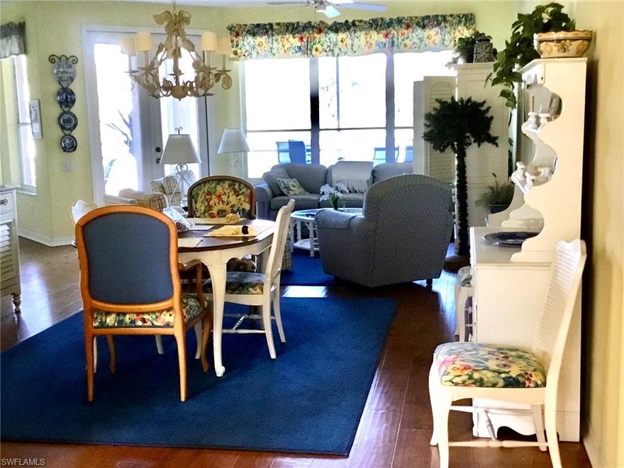 Enjoy happy hour on your tiled lanai looking out over the 16th fairway and 2 ponds. This first floor carriage home  features many upgrades. In the kitchen you will have granite counter tops and under mount sink as well as newer refrigerator and dishwasher. Hardwood flooring in the living room, dining room, den and kitchen. Newer carpets in the bedrooms. New A/C in 2017 and HWT in 2013.  Screened front entrance way. Vanderbilt Country Club has a beautifully remodeled and expanded clubhouse, a new attended health and fitness center and the new Terrace Cafe for informal dining that overlooks the community pool and tennis courts. Vanderbilt is a bundled golf and tennis community with a strong financial position and is an active social community.  Furniture can be left for convenience (no value).