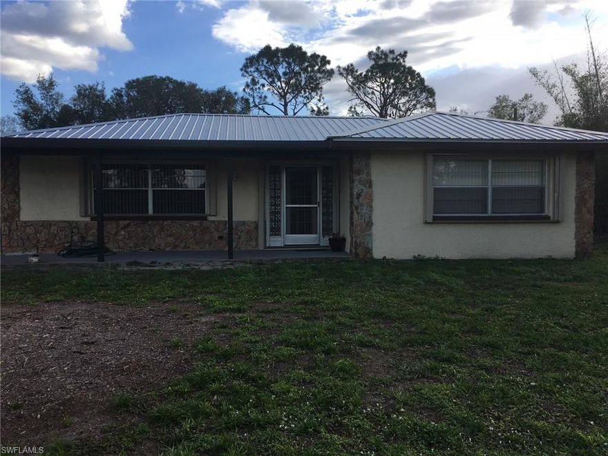 LIGHT, BRIGHT AND SPACIOUS. PERFECT MAINTENANCE FREE CONCRETE BLOCK HOME AVAILABLE IN ALVA. SPARKLING TILE THROUGHOUT, UPDATED BATHROOMS AND KITCHEN WITH NEWER APPLIANCES. METAL ROOF, HURRICANE SHUTTERS FOR EVERY WINDOW ON THE EXTERIOR, VERTICAL BLINDS  DRESS EVERY WINDOW INSIDE. HUNTER CEILING FANS IN EVERY ROOM. SOLAR POWERED ENTRY GATE, COMPLETELY FENCED, CONCRETE DRIVEWAY, 4 CAR CARPORT, FRUIT TREES THAT INCLUDE FIG, LEMON, FLORIDA PEACH, ORANGE, AND GUAVA. QUIET COUNTRY LIVING ON A DEAD END STREET. 1 BLOCK FROM THE COMMUNITY BOAT RAMP. 24' X 24' POLE BARN, 14'X 24' SHED WITH 220 POWER. LOTS OF STORAGE, BRING YOUR TOYS. WHOLE HOUSE GENERATOR 22KW, 10 YEAR WARRANTY & 500 GALLON PROPANE GAS TANK.  (400 GALLONS OF GAS IN THE TANK, INCLUDED) THE  INSULATED FLORIDA ROOM IS 12' X 26' A BONUS LIVING AREA WITH NEWER WINDOWS & 2 PORTABLE AIR CONDITIONERS. THE PROPERTY HAS IRRIGATION, 3 WELLS AND NEW PUMPS FOR ALL. THE LAUNDRY ROOM HAS NEWER STACKABLE KENMORE APPLIANCES. REVERSE OSMOSIS SYSTEM IN THE KITCHEN FOR EXCELLENT DRINKING WATER. THIS PROPERTY HAS BEEN WELL MAINTAINED WITH REGULAR PEST CONTROL. YOU MUST SEE THIS PROPERTY TO APPRECIATE EVERYTHING THAT IS OFFERED.