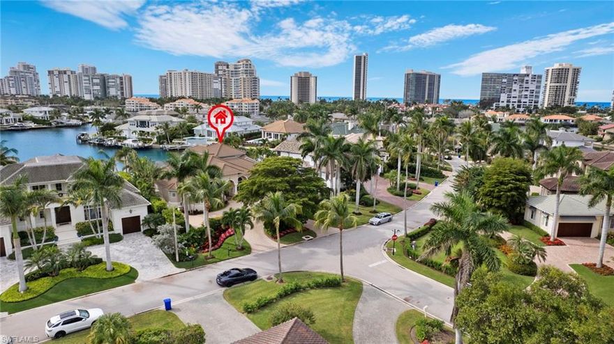 Welcome to 360 Devils Bight in prime Park Shore location - This 4 Bedroom/4.5 Bath with dock is sited on a great south facing lot with stunning Venetian Bay views.  Enter into the welcoming foyer with dramatic ceiling height to an open-concept living area featuring a chef's eat-in kitchen with white shaker cabinetry, white quartz countertops and breakfast bar, stainless steel appliances and walk-in pantry.  Separate wet bar area is ideal for entertaining with refrigerated drawers. Home office with custom built-ins, powder room and convenient laundry room. Walls of glass seamlessly blend the indoor/outdoor lifestyle opening out to screened-in lanai with pool, spa and sun shelf overlooking the bay.  Owner Suite with wall of glass sliders opening out to lanai.  Spacious bathroom with dual sink and separate bath and walk in shower.. Amazing dual walk-in closets.  2 additional guest suites with private bathrooms complete this floor.  Upstairs is the 4th en-suite with a large lanai overlooking the bay.  3-car oversized Air Conditioned garage.  Approximately 85 feet of bay frontage, dock and boat lift.  Easy access to Waterside Shops, Venetian Village and downtown Naples.