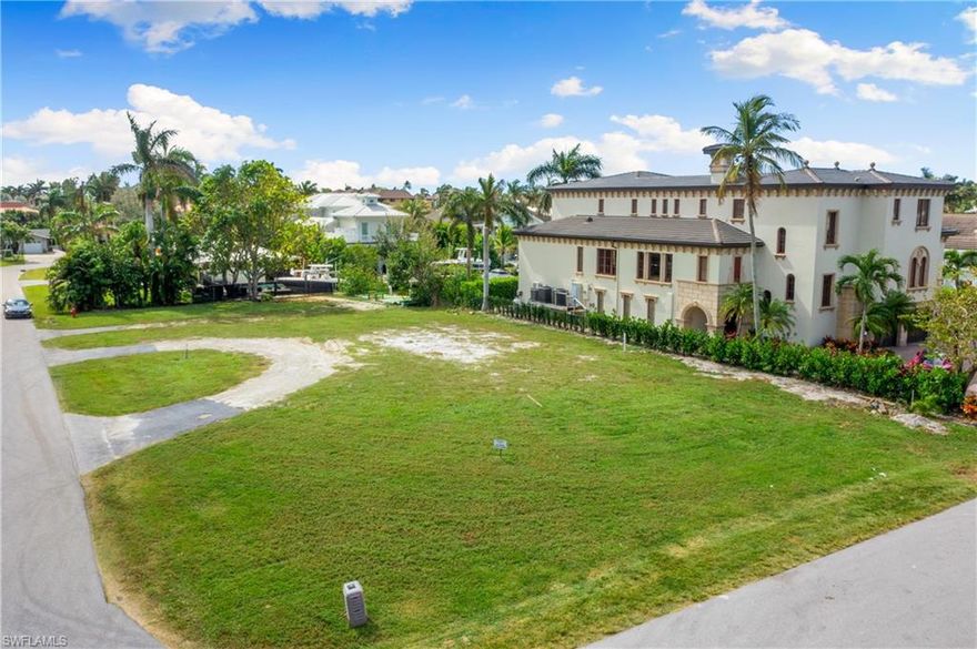 An exceptional opportunity awaits in the heart of Royal Harbor, one of Naples’ most desirable waterfront communities. This expansive .33-acre corner lot offers the ideal setting to design and build a custom coastal residence tailored to your vision. Perfectly positioned with direct Gulf access, the property is a rare find for both end users and builders seeking a premier Naples address.

The lot is cleared, level, and construction-ready, with permits already secured for a new seawall, boat dock, and lift, streamlining the path to waterfront living. Whether your days are spent cruising the waterways, heading offshore for fishing, or enjoying evening sunset rides, this location delivers effortless access to the Gulf.

For those looking to move quickly, thoughtfully designed architectural plans are available, providing a head start toward creating a sophisticated waterfront home.

Just minutes from the charm and energy of Olde Naples, you’ll enjoy close proximity to world-class dining, boutique shopping, art galleries, and entertainment, along with easy access to Naples’ renowned white-sand beaches. This is a rare chance to build in an established boating neighborhood where lifestyle, location, and long-term value converge.

Explore the potential and envision life on the water in Royal Harbor, where coastal luxury truly comes to life.