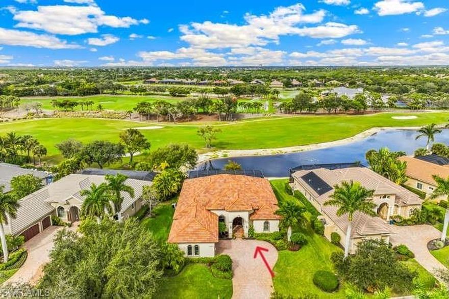 Exquisite custom home in Shadow Wood Preserve built by Harbourside Custom Homes! This lovely home boasts one of the finest views in the community featuring a blend of the lake, golf course, tropical landscaping and the clubhouse from afar! You will love the lifestyle with optional memberships for golfing, social activities and the private beach club! Desirable Great Room floorplan with so many wonderful features to highlight - porcelain tile throughout main living areas & bathrooms, magnificent double tray ceilings with custom molding (primary bedroom, living room, kitchen), arched niches for special paintings/photography and furniture, a custom-built entertainment center with wet bar & wine cooler (2023)! Very light, modern & functional kitchen featuring GE appliances including an Induction Range and Hood (Oct 2024) with air fryer & convection selections, Bosch Dishwasher (New 2024), Double Oven, Center island with Pompei quartz top, elegant, light-colored quartz counter-tops heighton the kitchen's appeal, farmhouse sink, walk-in pantry, white cabinets with custom lighting above and below! Whether dining with family or friends, you have options that include a formal dining room, the extended breakfast bar, the cozy dining nook with built-in window seat or on the covered lanai! The mitered glass window over the nook allows for unobstructed views from the kitchen & nook! The primary bedroom and bath will leave you speechless - the size, the view, two closets, two individual showers, two vanities with lovely marble tops! Enjoy your personal oasis with an expansive pool deck the width of the home (62' x 26') plus a large lanai space for outdoor dining and/or watching movies/sports in this peaceful space. NEW Pool Heat Pump (Feb 2025), NEW Pool Pump (Apr 2025). Outdoor kitchen with brick veneer, granite top, gas grill, mini-fridge & sink! Impact Windows & Doors (panels for Mitered Glass in Nook)! NEW Removable Flood Barriers (May 2025) with a 5 year limited warranty for the front entry, lanai sliders, inside door from garage & door by outdoor kitchen. Oversized garage (560') with plenty of space for vehicles & storage! Monitored security system and security cameras!  Central water with Water Softener Treatment System.