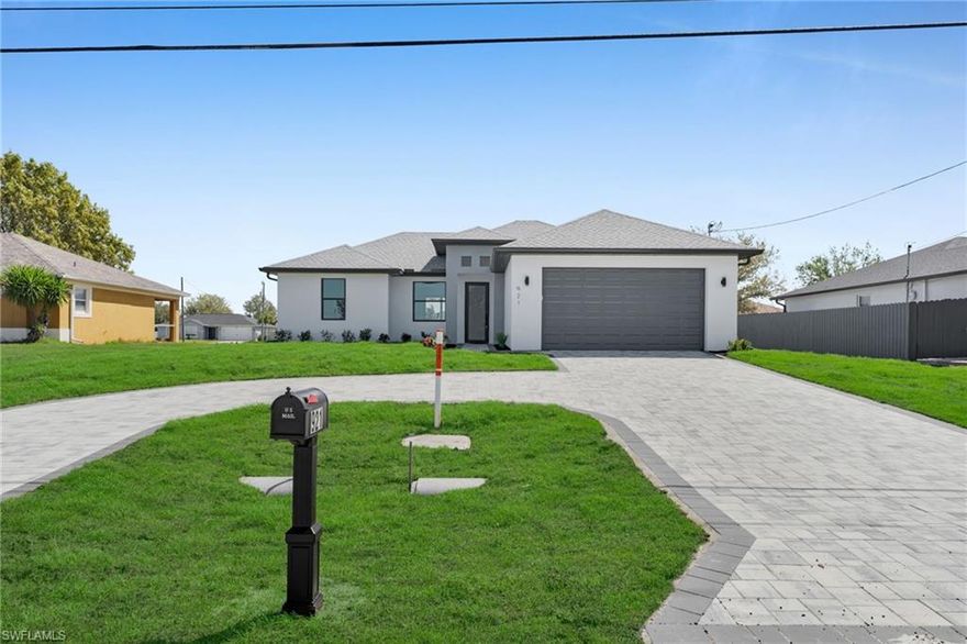 Beautiful newly built home (2026) located in the rapidly growing Northwest Cape Coral area. This open-concept residence offers 3 bedrooms and 2 bathrooms, featuring tile flooring throughout, high ceilings, built-in cabinets, and custom closets. Tray ceilings add a modern touch to the main living areas.
Exterior features include a circular driveway, paved surfaces, and an epoxy-coated garage floor. The property offers ample space for a future pool, perfect for enjoying the Florida lifestyle. Come take a look at this beautiful home offering exceptional features and modern comfort.