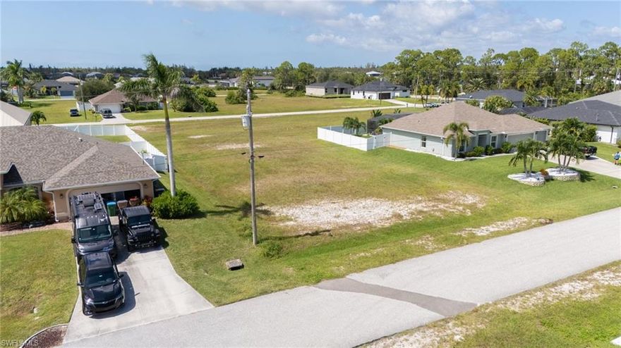 Discover an outstanding opportunity to own a clean, ready-to-build vacant lot. Perfectly positioned with western exposure, this property captures beautiful sunsets and abundant natural light, making it ideal for building a luxury home, vacation retreat, or investment property. Located just minutes from the visionary Seven Islands waterfront development, which will bring new marinas, dining, and vibrant lifestyle amenities to Northwest Cape Coral, and near the highly anticipated Tropicana Park, this lot is in the heart of one of the city’s fastest-growing and most desirable areas. The surrounding neighborhood continues to benefit from major public investments in parks, infrastructure, and green spaces, enhancing both the quality of life and long-term property values. Cape Coral, often called the “Venice of America” for its extensive canal system, offers a thriving real estate market that combines natural beauty, recreation, and strong growth potential. With its cleared condition and prime location close to future amenities, this western-facing lot is a smart choice for buyers or investors looking to build and capitalize on the city’s dynamic development.