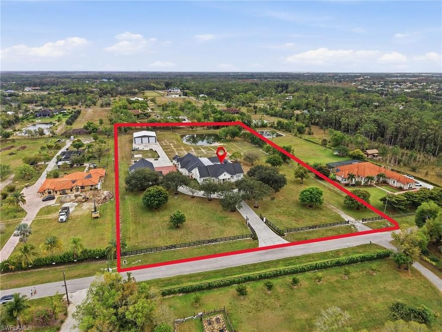 This exceptional estate offers a rare combination of luxury living, advanced construction with numerous appointments to detail, and unmatched versatility on a pristine 5-ACRE property with a pond. Located just minutes from shopping, restaurants, and the international airport, you will have the feel of privacy and seclusion with everything you need at your fingertips. Designed for both everyday comfort and grand-scale entertainment, the home features a spectacular resort-style outdoor oasis (2025), complete with a HEATED, SALTWATER POOL, expansive 4,000 sq. ft. SCREENED LANAI, OUTDOOR KITCHEN, bar area, pool bath, and multiple covered seating spaces creating a true private retreat. Inside, refined craftsmanship and thoughtful design are showcased throughout. The gourmet kitchen and BUTLER PANTRY are equipped with premium high-end appliances, including a 48” GAS DACOR COOKTOP with DOUBLE OVEN and built-in SUBZERO REFRIGERATOR, abundant storage, and generous prep space, ideal for hosting and daily living. The luxurious primary suite offers a spa-like bath, custom closets, and modern finishes overlooking your outdoor oasis. Upstairs, you will find an entertainer’s dream with a full-size HOME THEATRE – 133” screen, 8-person theatre seating, top of the line sound system, and built-in projector. GAMING AREA with Pool Table, 2 TVs & video game area. Ideal for multi-generational living or income potential, the property includes a private suite with its own entrance, kitchen, living space, and laundry. Advanced smart-home technology by Crestron, Mid Atlantic, Lutron & Sonos includes integrated sound systems, security, and lighting controls to enhance comfort and efficiency throughout. Car enthusiasts, business owners, or hobbyists will appreciate the impressive ACCESSORY BUILDINGS, including a high-clearance Bus (RV) BARN and large WORKSHOP/GYM/OFFICE COMPLEX with vehicle lift, climate control, and additional office space. Built with the highest construction standards, premium impact-rated features, whole-house RO water system, a backup generator, and multiple HVAC systems. Zoned AG – you could have a farm or run a business; the sky is truly the limit with gated access and the ability to subdivide approximately 1.5 acres. NEWER ROOFS (2023), NEWER HVACs (2018-2024- 6 units total) & NEW POOL (2025). This one-of-a-kind property delivers an exceptional opportunity to own a property that truly has it all: luxury, flexibility, and a lifestyle without compromise.