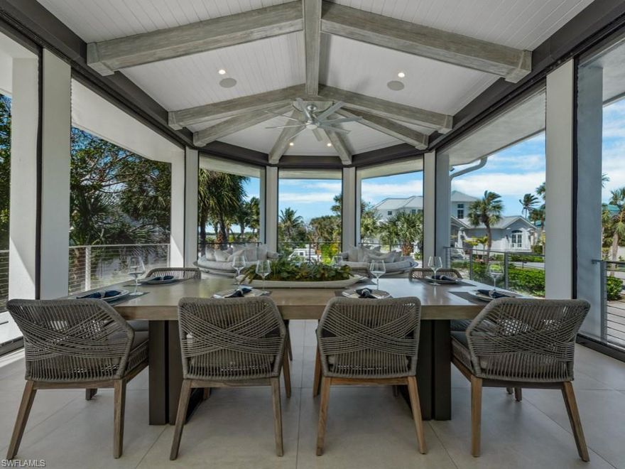 Located within the prestigious Hideaway Beach Club, this extraordinary custom residence offers over 10,000 square feet of indoor and outdoor living space showcasing a blend of luxury, architectural design, and coastal living with captivating Gulf views and prime proximity just steps from the beach and club amenities. Thoughtfully designed across three levels and served by a private elevator, this spacious residence provides exceptional flexibility for guests, recreation, and entertaining.
The main living level showcases an elegant open-concept design highlighted by Legno Bastone wide-plank wood flooring, coffered ceilings, linear vents, and a dramatic full-height stone fireplace anchoring the great room. A wall of 90-degree sliding glass doors seamlessly opens to the expansive terrace, creating effortless indoor-outdoor living. Smart-home features include Lutron lighting, motorized shades, Nest thermostats, integrated Sonos audio, and a Ring doorbell.
The chef's kitchen is designed for both entertaining and everyday living, centered around a stunning 10-foot waterfall quartz island and appointed with premium Wolf and Sub-Zero appliances including a six-burner gas range, steam oven, and Sub-Zero refrigerator, complemented by a Miele dishwasher, custom cabinetry, Blanco sink, walk-in pantry, under-bar storage, and a water filtration system.
Each bedroom is a private en-suite retreat with its own custom bath design and built-in closets. The third-floor primary suite offers sweeping Gulf views, a private sitting area with bar and beverage refrigerator, fireplace, spa-inspired bath with soaking tub and oversized shower, dual vanities, and an expansive custom walk-in closet. A private terrace and additional guest suite complete the level.
Outdoor living is equally impressive with 1,467 square feet of covered lanai, a custom electric-heated pool with dual waterfalls and fire feature, retractable screens, and a fully equipped outdoor kitchen featuring a Lynx grill, U-Line refrigeration, wine coolers, ice maker, and a 10-seat bar with Dekton counters.
Additional highlights include an infrared sauna, surfboard  outdoor shower, dual laundry rooms with Electrolux appliances, illuminated hardwood staircases, impact glass, motorized lanai screens, flood panels for the first level, a 500-gallon propane tank, and a generator.
Residents enjoy the exceptional amenities of Hideaway Beach Club, including a private beach, elegant clubhouse with three restaurants, a $25 million sports and wellness center, 9-hole golf course, tennis, pickleball, and bocce courts--offering a vibrant and active coastal lifestyle for family and friends.
A rare opportunity to own a truly exceptional residence in one of Marco Island's most exclusive gated beachfront communities.