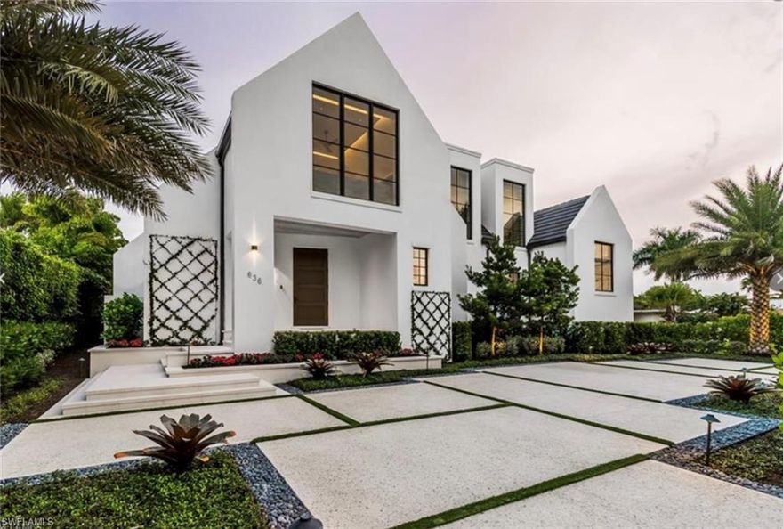 Highly desired Old Naples downtown location. This Custom residence is in the heart of Olde Naples. Designed by Harrell & Co Architects and Laura Hay Decor and Design, this breathtaking residence has southern exposure is located within walking distance to 3rd Street South and Naples renowned white sand beaches. Home features an open floor plan with modern design and decor and high-end finishes throughout such as custom cabinetry and millwork, Wolf and Subzero appliances, floor to ceiling glass, architectural ceiling detail, Moncer European oak floors throughout, Lurton lighting system, elevator, Lurton shades on all windows, temperature controlled wine room, whole house generator, natural gas and electric roll down screens and shutters. The inviting interior living space opens to a large outdoor living area complete with a summer kitchen, which overlooks the resort-style pool and spa and oversized sun/lounge area with artificial turf for sunbathing. This one-of-a-kind residence embraces the Naples lifestyle at its fullest and is steps from downtown Naples' world-class shopping, fine dining, and entertainment.