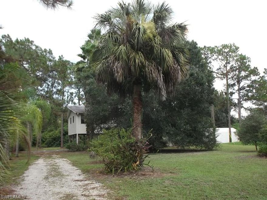 Welcome to a tropical paradise. 2 bedroom, 1 bath stilt home tucked away on lushly landscaped half acre lot in quaint Alva, Florida. This peaceful, tranquil oasis has a freshly painted interior. Step into the screened balcony to enjoy a nice summer breeze at sunset. Ample parking on the ground level.  This is a Fannie Mae HomePath property.