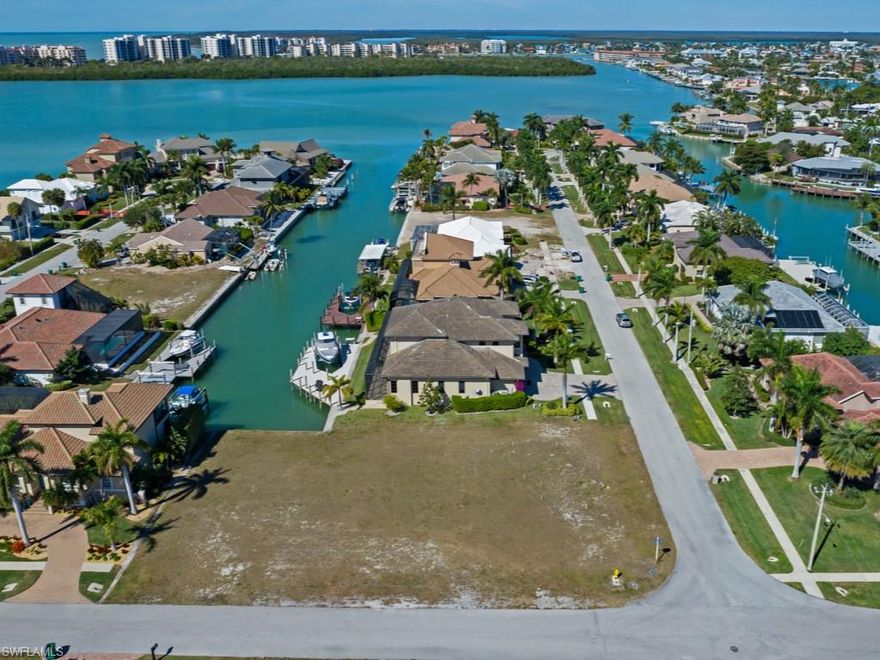 Magnificent water direct lot (no bridges by boat) in one of the most highly-desired neighborhoods at Marco Island with views of Collier Bay!  Surrounded by gorgeous estate residences and offering super close access to prestigious Collier Bay and beyond to the Gulf of Mexico by boat, this vacant parcel is the perfect place for your tropical dream home!  This gigantic lot will accommodate a massive estate home with a 4+ car garage with the benefit of plenty of room for tropical landscaping and green space in your side yard.  Close to popular restaurants, entertainment and shopping, too!