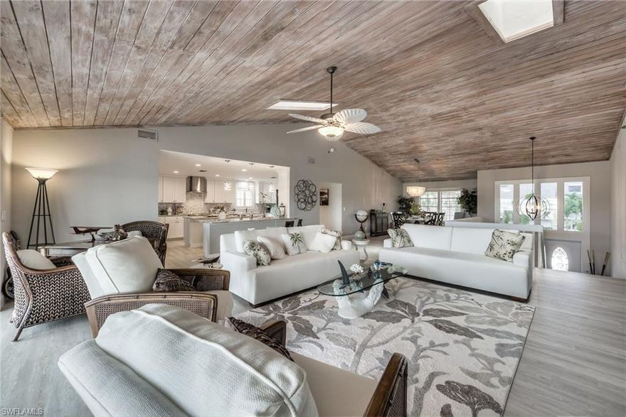 BIG BOATERS DREAM! One of the DEEPEST, QUICKEST, MOST DIRECT GULF WATER access canals in SWFL, with no bridges! SPACIOUS HOME WITH EXTRA LARGE ROOMS THROUGHOUT. BRAND NEW KITCHEN, FLOORING< LANDSCAPING, SPRINKLER SYSTEM, MASTER BATH, and Freshly painted throughout.  Wide open floor plan, vaulted ceiling, skylights, huge eat-in kitchen and full width balcony w/ modern cable rail overlooking salt water pool and canal. Climate controlled walk-in wine room. Large master bedroom with double french doors opening to balcony for beautiful sunrises. MB with dual vanities, large glass shower, & contemporary soaking tub. Lower level includes large 4th bedroom - extra large office/den w/ double french doors to patio - media room - and huge game room with tiki bar that walks out to salt water pool. This beautiful spacious home located on the deepest water gulf access canal includes large 3 car garage w/ electric hook up to accommodate your RV or TESLA.  ADDITIONAL FLOATING DOCK ACCOMMODATES AT LEAST A 60' YACHT. This attractive home or investment property has it all! WEEKLY RENTALS ALLOWED and offered with a HOME PROTECTION PLAN