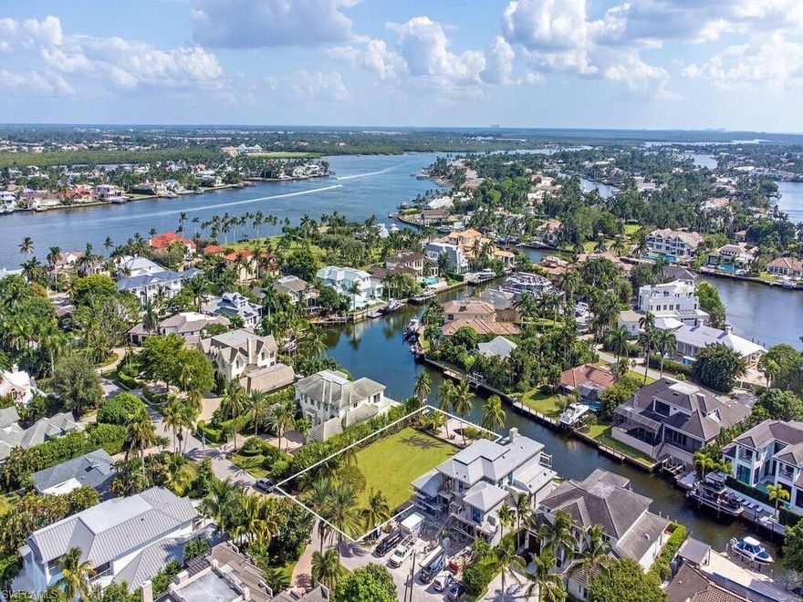 Amidst some of Naples' most exquisite and elegant waterfront homes sits a rare opportunity that offers a home site to design and build your dream home. This property is located on tranquil and dolphin-friendly Kite’s Cove, in highly sought after Aqualane Shores, and has a no bridge access to the Gulf. Southern exposure with approximately 80 feet on the water and a fantastic private, grandfathered in, cut-out dock with two boat lifts. Only a few short blocks to beach access and Third Street South's restaurants and chic shops.