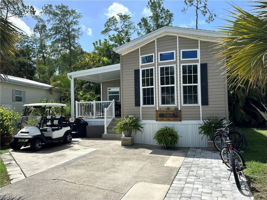 Charming 2020 Chariot Mobile Home with Expansive 2024 Addition and Spacious Front Deck.

Welcome to this beautiful 2020 Chariot mobile home featuring two bedrooms, and 1.5 baths. With high ceilings and an open layout, this home exudes spaciousness and light. The sellers added a stunning additional room with its own 1/2 bath in 2024 and included impact windows, creating an impressive living space perfect for guests or entertaining. The spacious front deck invites you to relax and enjoy the serene surroundings.

The property includes a golf cart and two bikes, making it perfect for exploring the community or enjoying the outdoors.

A 5 x 7 shed in the back offers additional storage, while the rear area of the home provides a peaceful oasis feel, perfect for unwinding or hosting friends. With high ceilings and an open layout, this home exudes spaciousness and light.

Corkscrew Woodlands offers tons of activities from tennis, bocce, pickleball, horseshoe courts, clubhouse, large community pool, shuffleboard courts, paddle boats for residents, nature trails and much much more. Great location convenient to FL white sandy beaches, restaurants, shopping and airport.

Located on an outer circle in a welcoming community, this mobile home is a must-see!