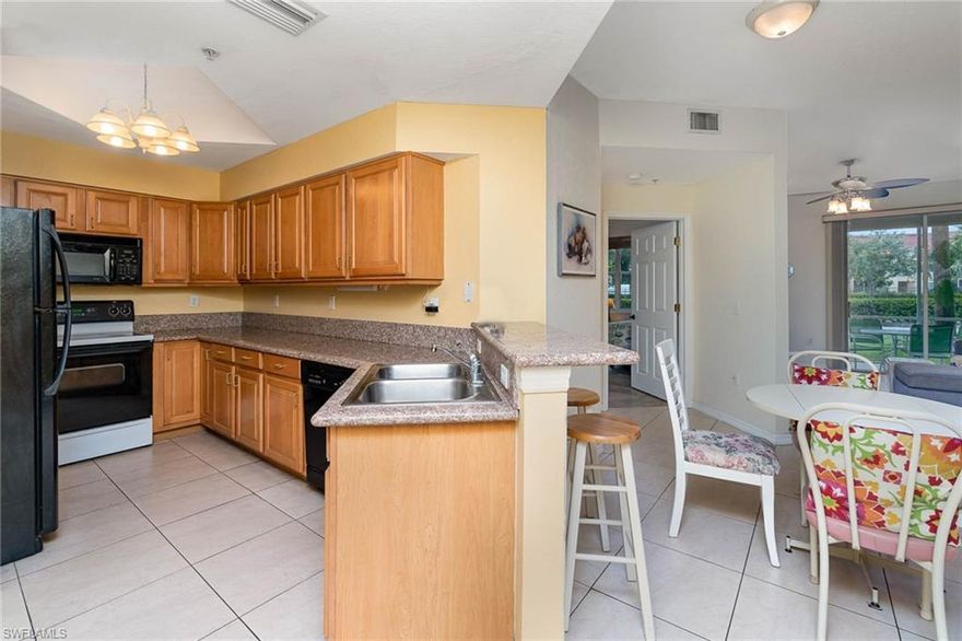 Come see this gorgeous TURNKEY, first floor, END-UNIT, move-in ready spacious 2 bedroom condo. Entertain your guests outside with this spacious screened lanai. This home features all tile throughout, walk-in master bedroom closet, and water heater has 5 year warranty. This community offers low HOA fees includes water, sewer, bldg. insurance, flood ins, pest control and beautiful amenities, including a tennis court and oversized heated pool. Come see this home, it won't last long!