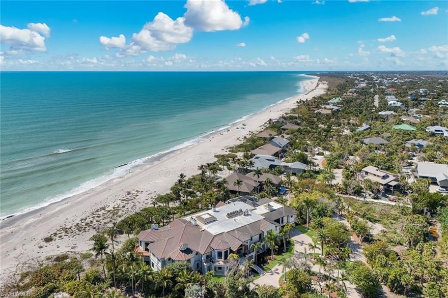 Set on 4.55 acres at the very end of West Gulf Drive, known as Sanibel's prestigious Gold Coast, on a private cul-de-sac, this extraordinary beachfront estate offers 245 ft of direct Beach & Gulf frontage, exceptional privacy, and a caliber of craftsmanship rarely seen anywhere in SWFL. Built without compromise, and running parallel to the sunset, allowing the home to capture Sanibel’s legendary Gulf views & Sunsets. A rare legacy estate. Encompassing nearly 20,000 SF with 6 bedrooms, a private office, 6.5 baths, and white-sand beach & water views from every room. Grand in scale yet livable, conceived as a multigenerational coastal retreat, suited for intimate family life, extended guest stays, and entertaining. Professionally decorated & furnished, a reflection of craftsmanship. The great room is dramatic and refined, anchored by 3 custom Barlas Baylar chandeliers, a hand-carved Calacatta marble fireplace mantel, herringbone hickory floors, mahogany ceiling beams with integrated surround sound, and concealed air systems preserving clean architectural lines. A full-length illuminated bar with underlit crystal counters brings the ambiance of a private five-star lounge, while integrated Crestron & Lutron systems provide sophisticated control of lighting, media, comfort, and shade. A Chef’s kitchen & separate service kitchen are outfitted with Thermador Pro Appliances, custom cabinetry, designer hardware, and a full butler’s pantry, ideal for private chef service & entertaining. An elevator provides seamless access across levels, while a dumbwaiter offers discreet convenience for household needs. Custom hand-crafted doors highlight the home’s attention to detail. Built to exceptional standards, the residence features a copper roof w/ matching copper gutters, $1.4M in Hartman windows & doors, and full hurricane shutters for an exceptional level of coastal protection. The Primary Wing offers 2 Gulf-front suites and office. The primary suite features a fireplace, private balcony overlooking the Gulf, direct beach access, a morning kitchen, advanced security features, and an exceptional bath w/ indoor & outdoor showers, a steam shower, an extraordinary walk-in wardrobe, dedicated laundry, Toto toilets in every bathroom. Guest accommodations are designed to provide comfort & privacy, including a 3rd-level suite with breathtaking views of Sanibel’s celebrated sunsets. Beyond its principal living spaces, the home offers scale to have a private gym, spa, game room, and lifestyle spaces tailored to multigenerational living & extended guest stays. Outdoor living rivals a luxury resort, w/ a beachfront pool & spa, lap pool, outdoor kitchen, lounge pavilion with reclaimed wood & fireplace, and a beachside putting green. Additional lot separately available, offering the opportunity to expand or create a private compound. Framed by palms, Gulf breezes, and the sound of waves, this ultra-private residence is one of the most significant estates in Florida.