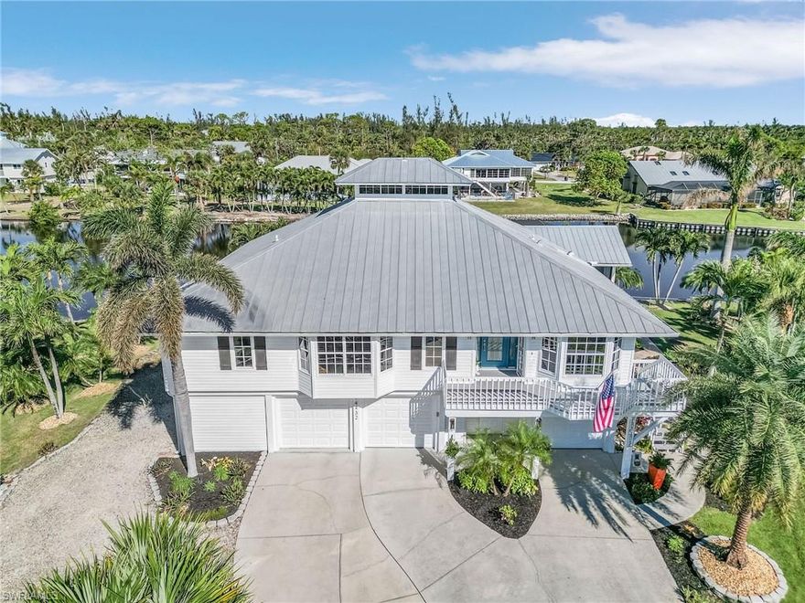 You must consider one of the prettiest homes on the Island! This beautifully updated stilt home will not disappoint. Meticulously maintained, fully furnished and available turnkey, including most decorations (ask for exception list). Bring your suitcase and start enjoying the serene lifestyle you’ve been dreaming of. The living space is bathed in natural light, thanks to large windows that frame stunning views of the nearby lake. The stylish, contemporary design features high-end finishes, including a gourmet kitchen with premium appliances and Cambria quartz countertops. The spacious living and dining areas flow seamlessly, offering a relaxed atmosphere with water views. The home offers four spacious bedrooms and three beautifully updated bathrooms. The primary suite provides tranquil lake views. Beneath the main living area, there’s a separate bedroom and bath—ideal for guests or additional privacy, plus a three-car garage. Outside, you'll find your private paradise. The expansive pool and patio area create the perfect setting for outdoor entertaining, sunbathing, or enjoying the peaceful surroundings. The elevated design of the home ensures privacy and unparalleled views of the lake, making this the ideal spot to unwind and soak up the beauty of Pine Island. This stilt home combines the best of both worlds: modern, updated living in a tranquil, nature-filled setting. With easy access to the nearby marina for fishing, boating, or simply enjoying the view. Pine Island is waiting for you!