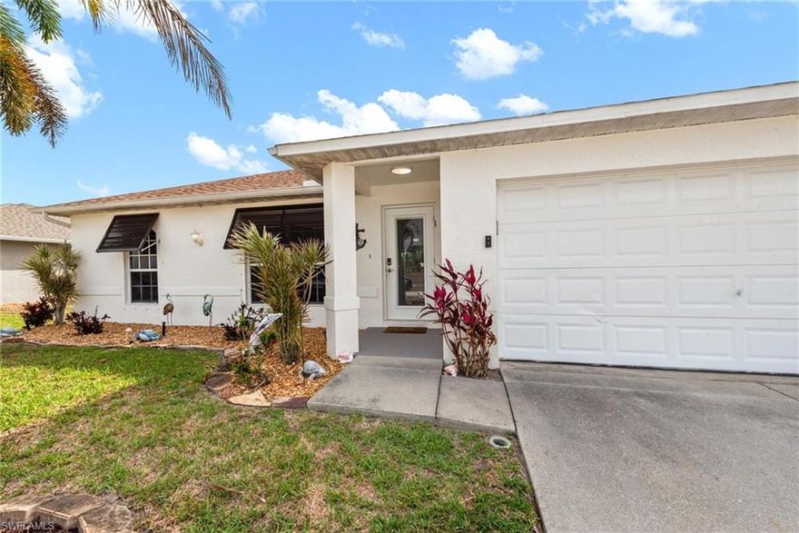 Located in a non-flood zone, this exceptionally maintained 3-bedroom, 2-bath home in desirable NW Cape Coral! This inviting home features an open floor plan with vaulted ceilings, split bedrooms for added privacy, and tasteful upgrades throughout. The kitchen was remodeled with cabinet refacing, granite countertops, backsplash, and a stainless farmhouse sink, while both bathrooms were updated with new vanities and lighting. Additional improvements include luxury vinyl flooring, 5” baseboards, a 2022 A/C, new hot water heater, whole-house alarm system, and reverse osmosis drinking water. Step outside to the showstopper—an extended and enlarged lanai designed for entertaining, complete with a built-in outdoor kitchen featuring a grill, 2-burner stove, sink, under-counter ice machine, new pavers, and cement countertops. The fully fenced backyard also includes an avocado tree and hurricane shutters for added peace of mind. A true move-in-ready gem in a great NW Cape neighborhood!
