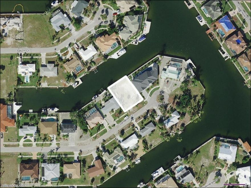 Build your dream home on this exceptional waterfront homesite boasting beautiful views of Saturn Waterway and Gulf access! Enjoy close proximity to Marco's beautiful crescent shaped beach, restaurants, shopping, and more