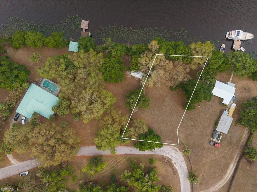 OVERSIZED RIVERFRONT VACANT LOT LOCATED ON THE BANKS OF THE CALOOSAHATCHEE RIVER IN LABELLE WITH GULF ACCESS! 110 ft of waterfront to enjoy fishing, boating and nature watching. Plenty of room to add a dock and lift. Approx .43 acres of partially cleared land to build your dream home and pool. Zoned low density single family residential. Great location close restaurants, shopping, schools, LaBelle Nature Park, Eucalyptus Village Sports Park & Pool, and a short drive to Lake Okeechobee. Don’t miss this opportunity!
