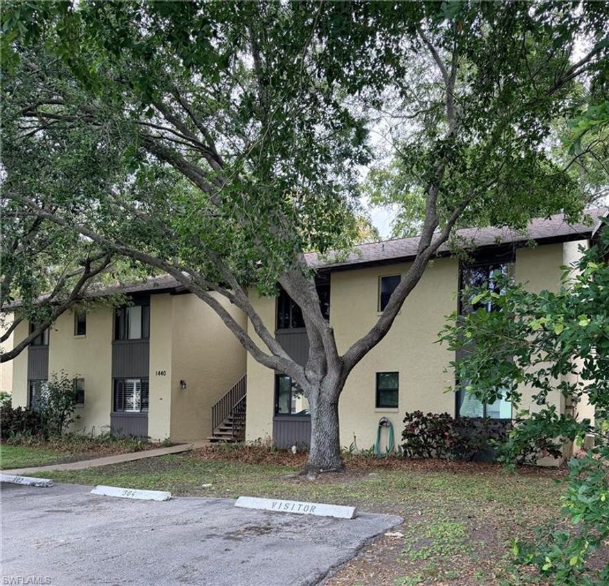 Location, Location, LOCATION --- Literally 5 minutes to Downtown Naples and the Beaches. This is likely a community that you pass by everyday and never even realize it is there. Located off Davis Blvd just West of Lakewood, between St. Paul's Episcopal Church and Tint World. Who knew?!? Grocery, dining and shopping all minutes away. If your proverbial middle name is "HANDY", THIS is the property for you. Priced right for 1st Time Homebuyers looking for a great deal on a home to mold in to your personal retreat. Let's talk frankly. This unit has great 'bones'; just needs to find the right family to adopt it and give it the love that it deserves. It has dark wood floors throughout the entire unit that look to be in pretty good shape. The white appliance package are believed to be in good working order. A fresh coat of your favorite color paint will bring this unit to the next level. The lanai has been enclosed with glass so that you can choose whether to enjoy extra A/C space or choose to open for fresh air. The primary bedroom has it's own private ensuite bath with tub/shower combo and the guest bath is a shower-only. LOW HOA includes cable, water, trash, lawn and pest exterior... your only extras are electric and internet. INVESTORS Welcome. Easy to lease. Are you ready?!? Let's do this!