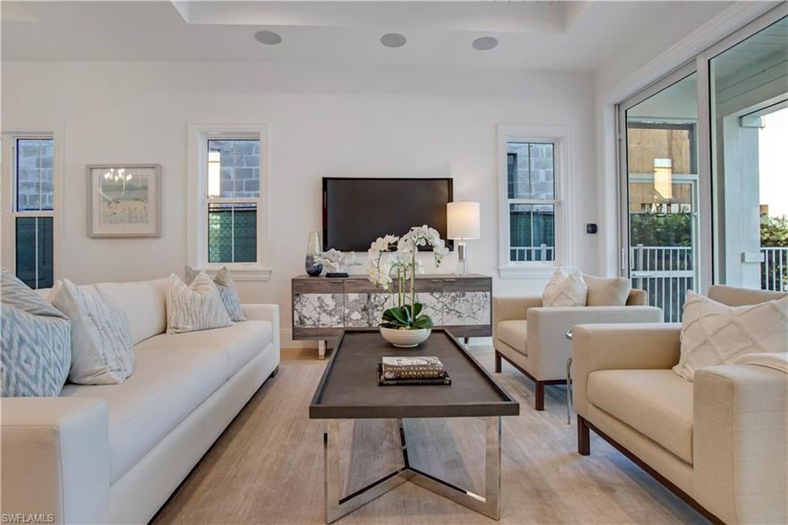 This superb Coastal inspired family home designed by Don Stevenson is the best value in the heart of Olde Naples and only a short walk to restaurants and shopping and across the street from the boat launch to Naples Bay. Refined elegance with a comfortable yet classic feel welcomes you as you step through the front door. The open layout, natural light and inviting hues utilized throughout the home fused with modern building advancements make this single family residence truly exceptional. The main house has 3 generous sized en-suite bedrooms, a powder bath on the first floor, study with temperature controlled wine vault, security system, an elevator and a spacious living and dining room opening up to the kitchen. There is a full, detached guest suite and rooftop sundeck above the garage. The exterior living area comprises of a covered outdoor lanai with remote control screens, a natural gas fireplace, outdoor kitchen with private pool, spa and sundeck.