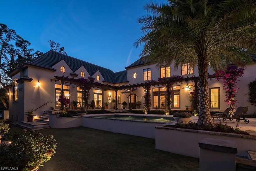 This inspiring lakeside home is as comfortable as it is architecturally charming. A tranquil ambiance prevails throughout, with primary emphasis on a flowing contemporary floor plan. The kitchen, dining, and lounging spaces are all without intruding walls under the same soaring ceiling with wood beam detail. There is immediate access to a large porch for serene and relaxing views overlooking Lantern Lake. The very private first floor master suite also focuses on lake views. A second first floor suite functions with equal ease as a guest bedroom with ensuite bath or as an office with access to the sun-filled pool courtyard. Two other bedrooms are upstairs offering other members of the household or guests their very own special havens. On the east side of the luxurious pool is a separate and engaging pool retreat, equipped with built-in grill and fireplace, highlighted by a cozy under roof sitting area, and a bathroom/changing room. In a storybook setting, the home is just minutes from the Port Royal Club with its celebrated beachfront dining and well-equipped and superbly managed spa facilities. Port Royal Club membership eligibility.