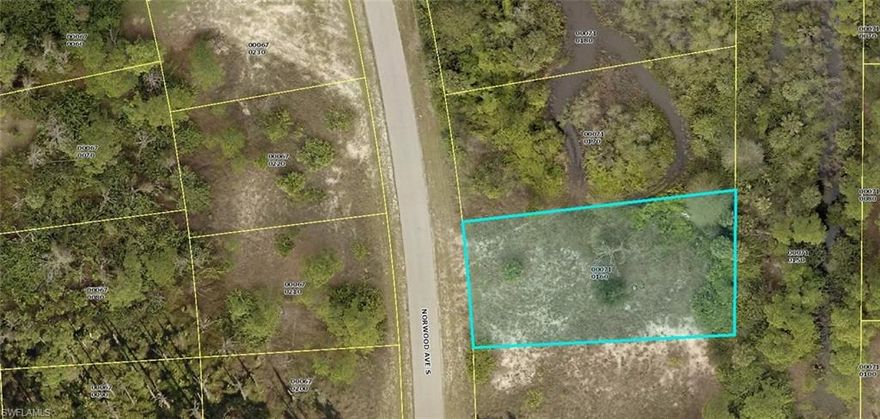 .33 Acre lot in nice quiet area of Lehigh Acres. There are two other lots in addition to this lot available side by side. Great for a builder to build three homes in a row and create a nice area of new homes.