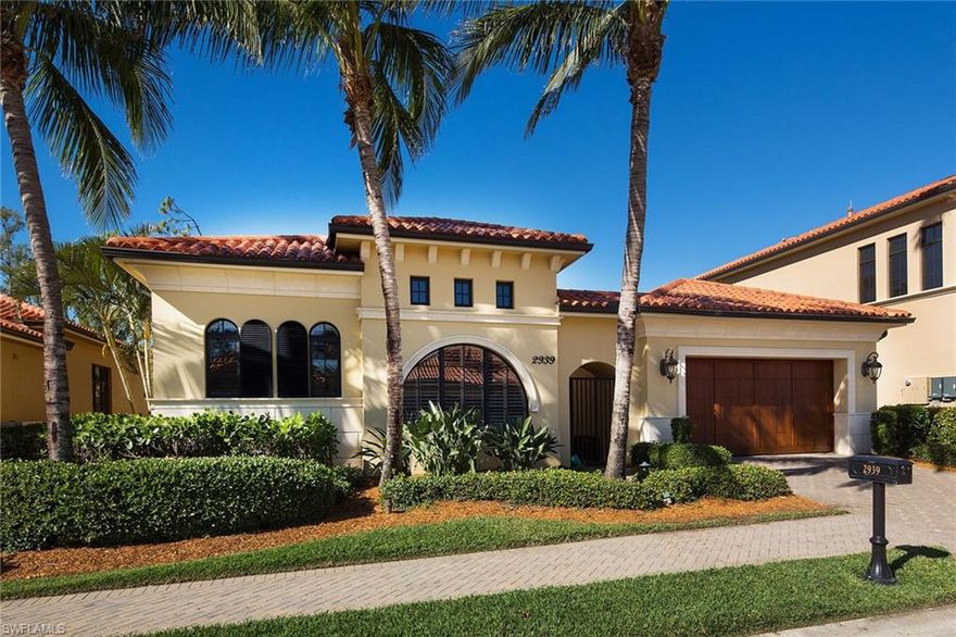 Every imaginable upgrade has been beautifully woven into this single-story home with western exposure. Exceptional features include 14' ceilings, elegant, neutral decor with travertine marble flooring, upgraded appliances, 35KW whole house generator, electric storm shutters and a custom-designed pool and spa with lush landscaping. Enjoy majestic sunsets from this western exposure lot overlooking the sixth hole of the Gold Course at Tiburon/Ritz-Carlton Golf Resort, managed by world-renowned Troon Golf. Beautiful lanai with summer kitchen boasts a Viking grill and covered seating areas making entertaining a delight. The Ritz-Carlton Resort is the centerpiece of this lovely community with a clubhouse, fitness center, multiple restaurants and soon-to-be-completed lazy river resort pool. Tiburon is in a beautiful and convenient location close to Mercato and with private concierge service and a convenient beach shuttle. HOA fee includes weekly lawn and pool service. REALTORS®, see comments.