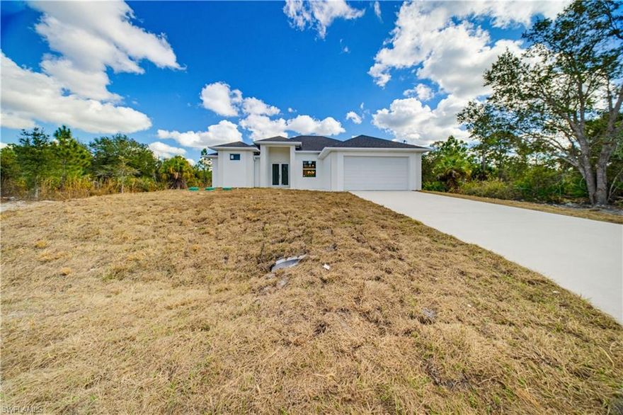 New construction in one of the mosr desirable area of Lehigh Acres Florida. This new house with 3 bedroom and 3 bathroom has a great potential, car garage with a lateral door for easy access to the patio.
This half acre lot is ideal if you are planing to build a gezebo and or pool.
Impact windows and door and high ceiling, walking closets an the 3rd bathroon with access to the patio.