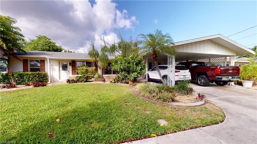 Rarely available oversized corner lot 2 unit duplex with amazing views of two canals. Both units have their own laundry rooms. Unit 1 is a two-bedroom, 1 bathroom with a brand new kitchen installed in 2020. Includes wine fridge, soft close cabinets, quartz countertops, and a huge peninsula with seating for 5. Unit 2 is currently configured as a 1 bedroom 1 bath plus den. French doors were removed from the second bedroom to make the den. Easily converted back with new 6' french doors. Huge Lanai with roof enclosing the 26x10 solar heated pool. There is a carport with space for two cars along with a parking pad and additional parking spaces at the end of the driveway.