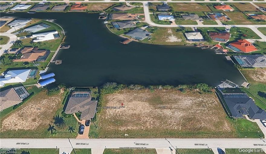 Rare Gulf-Access Opportunity on 474’ Wide Killer Lake – ASSESSMENTS PAID!

Build your luxury waterfront retreat on this cleared waterfront lot ideally positioned on the expansive 474-foot-wide Killer Lake in the highly sought-after Pelican neighborhood of Southwest Cape Coral. This exceptional homesite offers over 500 feet of long-range water views, creating a dramatic wide-water backdrop that standard canal lots simply cannot match.

Enjoy Gulf access for boating enthusiasts and a location surrounded by well-maintained, high-end homes. With proximity to Chiquita Boulevard dining and shopping corridor, and nearby Fellowship Park, this property offers both lifestyle and convenience.

All city water, sewer, and irrigation assessments are paid in full, saving the buyer thousands in upfront costs.

One of the few remaining premium wide-water lots on Killer Lake, this homesite is perfectly suited for a custom residence designed to maximize sweeping water vistas — imagine an infinity-edge pool overlooking the basin and spectacular Florida sunsets from your backyard.

Don’t miss this opportunity to secure a prime waterfront property in one of Southwest Cape Coral’s most desirable neighborhoods.