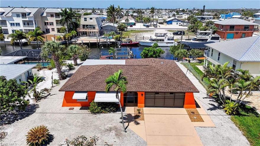 ST.JAMES CITY-PINE ISLAND! THE "SALT LIFE" FISHING-BOATING-BEACHES IS CONSIDERED ISLAND LIFE HERE! THIS CUTE "FISHERMAN'S COTTAGE" IS "FLORIDA KEYS" STYLED LAID BACK ISLAND LIVING, YET CLOSE TO EVERYTHING! COMPLETE HOME REMODEL (2024) OVER $250,000+/- AS GONE INTO THIS FURNISHED "TURNKEY" 3BDR, 2TH, 2 CAR GARAGE, DOCK, LIFT & LITHIUM POWERED BATTERY NEW GOLF CART. OPEN FLOOR PLAN, ALL TILE FLOORS THROUGHOUT FOR EASY MAINTENANCE, ALL NEW ELECTRICAL AND PLUMBING WENT INTO THE REMODELING OF THE HOME. ALL TILE FLOORS, NEW A/C, BRAND NEW ROOF 2023, ALL WINDOWS & DOORS ARE PROTECTED "IMPACT STORM" RESISTANCE "BAHAMA AWNINGS" FOR TOTAL PROTECTION. NEW REMODELED KITCHEN WITH WHITE SHAKER CABINETS, ALL STAINLESS STEEL APPLIANCES & LEVEL 5 QUARTZ TOPS. HUGE MASTER BEDROOM, WALK IN CLOSET, GRANITE VANITY, FLOOR TO CEILING GLASS & MARBLE WALK-IN SHOWER. BOTH GUEST ROOMS HAVE BEEN COMPLETELY REMODELED INCLUDING THE BATHROOM. HOME HAS A COVERED LANAI FOR ENJOYING THE WATERFRONT AND FANTASTIC "SUNSETS" YOU GET IN THE EVENINGS SHADE. HOME HAS A "CAPTAINS" WALK AROUND DOCK WITH (10,000LB) LIFT WITH WATER & ELECTRIC FOR ALL FOR BOATING NEEDS. OPEN WATER IS A SHORT 10 minutes excursion.  NEW 2023 A/C WITH WARRANTY. THE LANDSCAPING OF THE HOME "ZERO SCAPE" WAS DESIGNED WITH EASY MAINTENANCE: TALK ABOUT RENTAL APPEAL, COULD BE A HUGE RENTAL ATTRACTION PROPERTY WHEN NOT IN PERSONAL USE! HOME COMES WITH 1 YEAR HOME WARRANTY FOR TOTAL BUYER COMFORT.