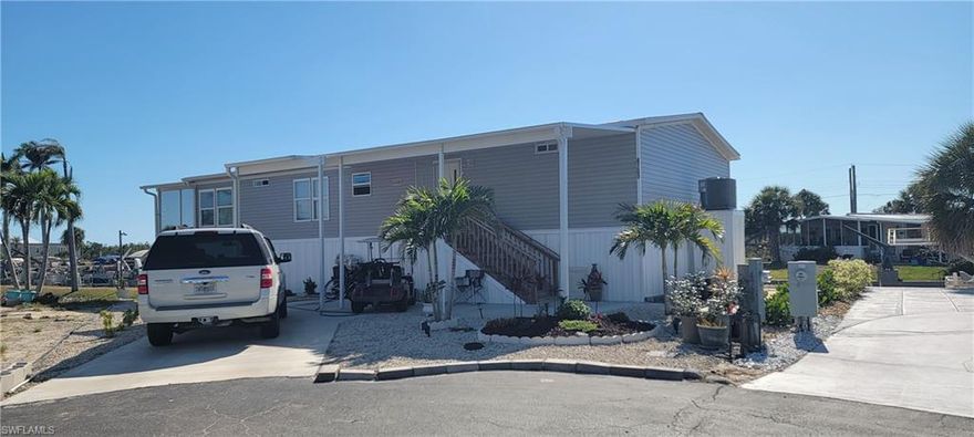 For Rent NEW 2024 manufactured home which sits on a canal at one side and the lake on the other side. Water views are everywhere! Furnished home has 2 bedrooms 2 baths, plus a office / den. From this bonus room is a screened room which overlooks the lake with a fountain and the Gulf access canal. This is a 55 plus community, no children. no smokers or no pets. The covered boat lift would accommodate a 24 foot boat weighing about 7000 lbs. is an optional feature that can be negotiated. This amenity rich community has an active clubhouse w/ planned activities, pool, hot tub/spa, tennis, pickle ball, shuffleboard, basketball, boccie ball. The community park offers a picnic area, tiki hut w/ swings, & fresh water fishing on the lake pier and community kayaks for residence & guests. The community proudly presents direct access into Estero Bay then into the Gulf of Mexico from the private boat ramp for all residents to use. Once on the water there is fishing, shelling, beaches, waterfront restaurants and watching dolphins, and sunsets before returning home in minutes! Spring Creek Village has a convenient location. Coconut Point Mall and the new Lee Health at Coconut Point are just minutes away. The Hertz Sports arena, restaurants, shopping, public golf courses, FGCU, Fort Myers International Airport are all close by.
