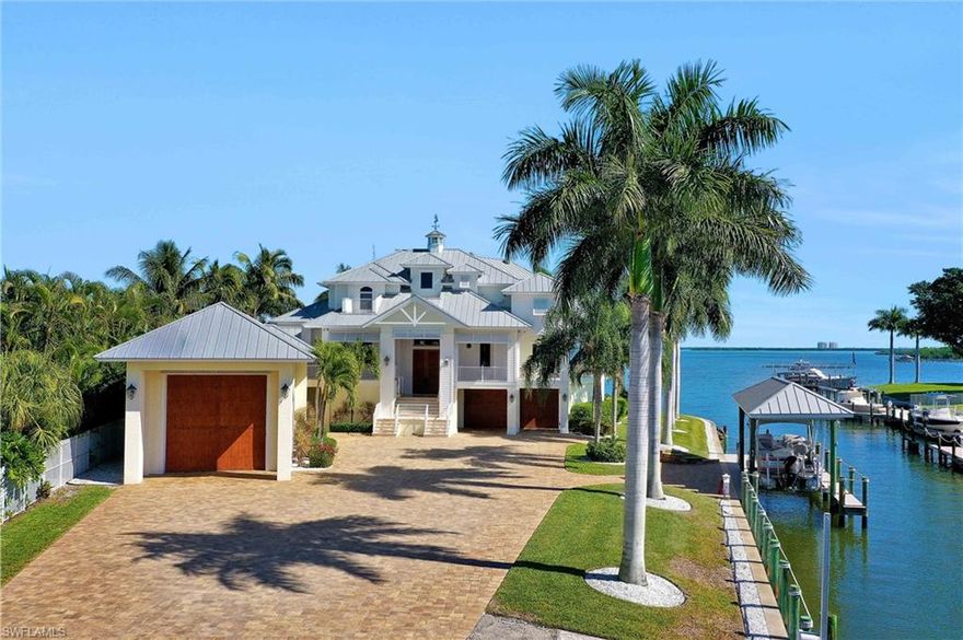 With a show-stopping list of features that’s sure to impress even the most astute buyer, this Key West-style turnkey furnished home is a must-see. An absolute master-class in luxurious living, you will love the spacious layout set on a ¾-acre lot with 425-feet of water frontage. There are 4 bedrooms and 4 baths spread throughout the home while entertaining is made easy thanks to the wrap-around covered porches, outdoor kitchen, bar and glistening saltwater infinity-edge pool. From the custom finished elevator and the gourmet kitchen with state-of-art appliances and granite counters to the outdoor fireplace and opulent master suite with bamboo flooring and walk-in closets, not a single detail has been overlooked. The layout has been expertly crafted to showcase the spectacular views with 9-foot electric pocketing sliders opening to reveal the glorious water vista.The boating enthusiast will love the huge boathouse, 16,000 lb boat lift and two docks, along with living just a 10-minute trip from the Gulf. There’s a 55-foot custom RV storage garage with a motor workshop plus there’s also room to store up to 6-8 cars. This is a truly remarkable home that needs to be seen to be believed.
