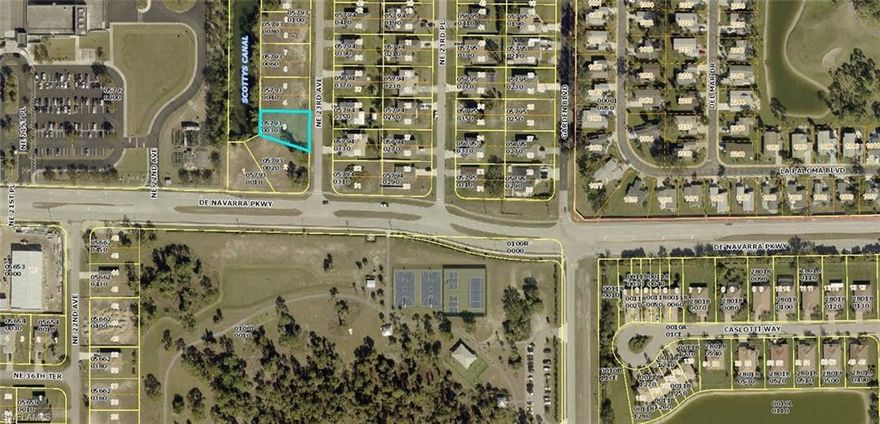 Within WALKING DISTANCE to the new Gator Trails Park, you'll find this wonderful residential building lot with water frontage on Scotty's Canal.  *This is a NON-FLOOD zone, and the western rear exposure will provide a beautiful skyline when the sun sets each evening!  *The brand new ALDI's grocery store recently opened, and you are just minutes away.  *With Island Coast High School right around the corner, your children can skip the bus stop along with early morning school bus pickups and WALK to school! *Join this active, growing, neighborhood when you build your new home.  *Opportunity waits for kayaking, boating, and birdwatching from your own backyard, and the Florida lifestyle can be yours too!
