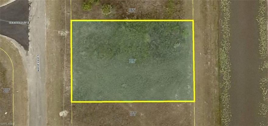 Really nice high & dry nearly 1/4 acre on canal homesite (width 80' x 125' deep) in a nice area of single family homes in LEHIGH ACRES, Florida. Property is located on a quiet street & features an on-canal desirable Eastern morning sunrise views at the rear of the homesites with quick & easy access to State Road 82, Columbus Boulevard, Sunshine Boulevard, Lee Boulevard, shopping, restaurants, recreation, schools, medical services, boating, golfing, SWFL International Airport & all that Southwest Florida has to offer. The at rear of the property exceptionally large & wide fresh water canal is home for many beautiful birds & wildlife. Western sunset views facing the entrance - street side of the property. County maintained paved road with power already at the street. Build your dream or vacation home now and/or save this special area homesite for later. Don't miss this unique opportunity to purchase this choice property for only $8,995 with SELLER DIRECT FINANCING (US) with $0 (ZERO) down, no credit check, no job or income verification for ONLY $98.00 per month payment. Personal checks are welcome. Take a first and/or second look soon ... you'll be so glad you did...