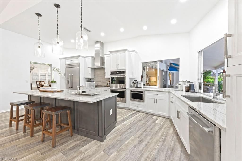 Photo of 1918 Imperial Golf Course BLVD, NAPLES, FL 34110 (MLS # 226012597)