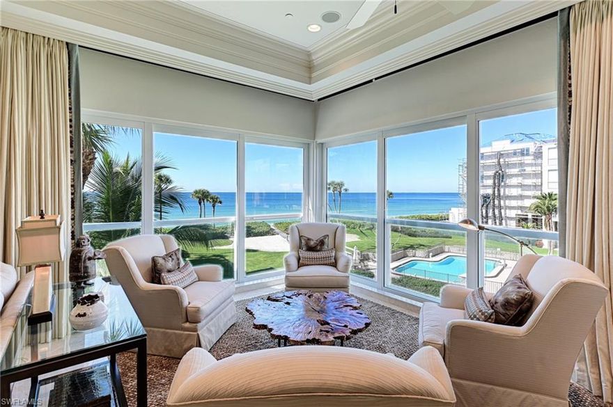 Rare opportunity in Barefoot Beach to purchase a beautiful 4 story Beach home with an additional 1/2 lot for a swimming pool or addition. This home is all about the wide Gulf views & sunsets. It's a true oasis with a landscaped 1/2 lots adjacent to the east, a landscaped full lot to the west, a double landscaped lot to the south & manicured beach garden & pool area to the north.  Features include 4 bedrooms, 6.5 baths, office with wall bed & full bath, game room with wall bed & full bath, open floor plan with kitchen living & dining, second large living room, the whole 4th floor is dedicated to the master suite including living area & deck overlooking the gulf, large 5th story roof top viewing & entertaining deck for grilling and parties. Features incl. impact windows & doors, whole house generator, beautiful entrance with tropical rock waterfall fountain, private 4 story elevator, fitness area, smart home technology, audio, video & security, and a beach garden swimming pool between the home & beach. Guard gated entrance, clubhouse with fitness, game room, tennis & pickle ball included. Boat docks across the street are a separate purchase with gulf access no bridges.