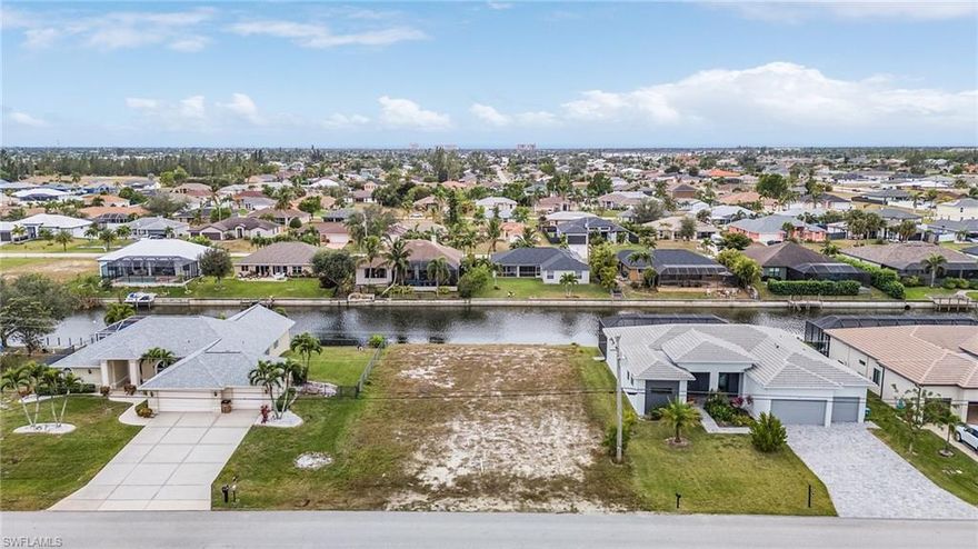 MUST SEE SOUTHERN REAR EXPOSURE CAPE CORAL FRESH WATER LOT READY TO BUILD. NEW SEAWALL INSTALLED 2023 AND ALL ASSESSMENTS PAID, ON A NICE WIDE CANAL WITH NEW CONSTRUCTION ALL OVER DONT MISS OUT.