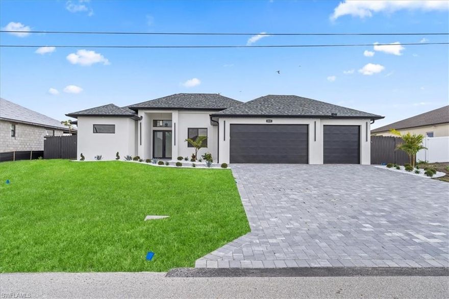 Brand new canal-front home offering over 1,900 sq ft of living space with a 3-car garage and private pool. This 4 bed, 3 bath features a clean, modern design with high ceilings, impact windows and doors, and a bright open layout. The kitchen anchors the home with an oversized island, sleek cabinetry, and built-in appliances, flowing seamlessly into the main living area. The living room is highlighted by a accent wall with a built-in fireplace, adding warmth and a custom touch. A stylish wet bar in the dining area makes entertaining effortless. Tile flooring runs throughout, and all closets are fully built out.
The split-bedroom layout offers added privacy, with a spacious primary suite featuring dual sinks, walk-in closets, double showers and a tub. 
Sliders open in your primary and living area to the lanai and pool overlooking the canal and a covered outdoor kitchen/patio area, creating an easy indoor-outdoor lifestyle in a desirable waterfront setting.