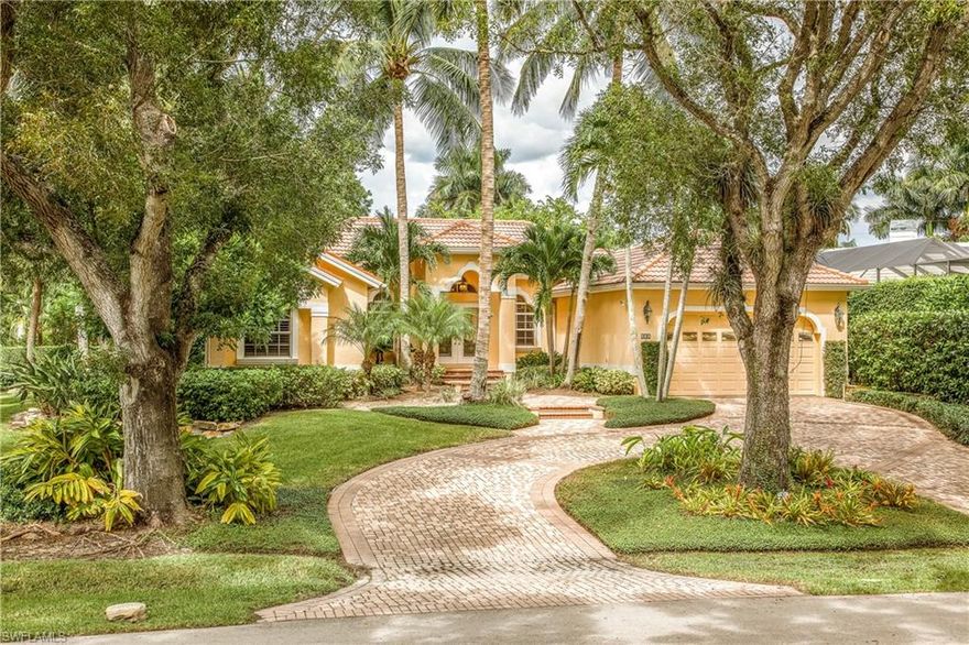The world famous sugar sand Naples Beach is just steps away from this charming single story retreat with a spectacular custom pool and private outdoor living area. This three bedroom plus den home with a two car garage provides over 2,200 sq ft. of generous living space. The open floor plan with high ceilings emphasizes indoor-outdoor living and entertaining.  Conveniently located on the corner of one of the most beautiful streets in Old Naples and the prestigious Gulf Shore Boulevard this property is in close proximity to upscale shops and fine dining in Old Naples.  A rare opportunity.