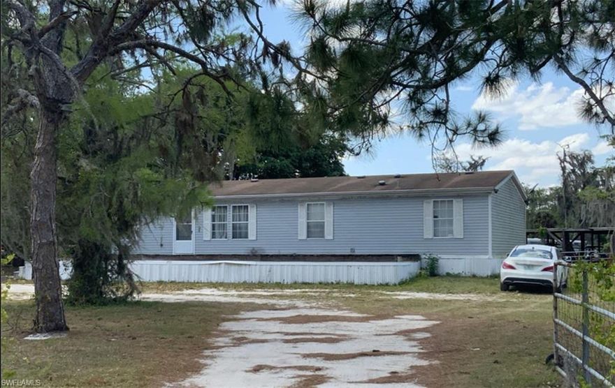 Investment opportunity or family retreat potential! This 1996 manufactured home on 2.5 acres currently has a tenant in place on a month-to-month lease, providing instant income for the new owner. The property can also be purchased together with the adjoining parcel and home, creating the perfect setup for a multi-generational living arrangement or family compound.
Drive-by viewings are welcome, but no interior showings will be permitted until an accepted offer is in place out of respect for the tenants’ privacy. Don’t miss the chance to own an affordable property with flexible potential in Clewiston’s peaceful rural setting! Seller really would like to sell this with adjioing parcel MLS#2025006290, making it a total of 5 acres with 2 homes for $884,000.