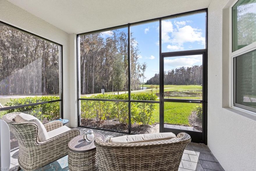 Welcome to an exceptional opportunity in The National Golf & Country Club at Ave Maria—now vacant and ready for immediate enjoyment or investment just in time for the 2026 season. This highly sought-after first-floor Birkdale model is being offered fully turnkey and move-in ready, ideal for seasonal use, rental income, or full-time living. This well-maintained condo offers 2 bedrooms, 2 bathrooms, and 1,154 sq. ft. of open-concept living and showcases the coveted trifecta of views—golf course, water, and preserve—creating a rare and serene backdrop. The kitchen features a large island, stainless steel appliances, pantry, and upgraded tile backsplash, flowing seamlessly into the living and dining areas. The screened lanai is the perfect place to relax and enjoy peaceful sunsets and scenic views. Upgrades throughout include crown molding, fresh designer paint, tasteful accent walls, and tile flooring throughout—no carpet. The owner’s suite offers a walk-in closet and an en-suite bath with a glass-enclosed shower, while the guest bedroom and full bath provide privacy and comfort for visitors. Additional features include impact-resistant windows and doors, a full laundry room, covered carport, and ample guest parking. The unit is conveniently located near a satellite pool for easy access. This condo includes a private bundled golf membership, providing unlimited access to the championship 18-hole course and world-class resort amenities, including resort and lap pools, fitness center with classes, full-service spa, pickleball, tennis, bocce, dining, and more. HOA fees cover cable, internet, water, trash, exterior maintenance, pest control, and 24-hour security for worry-free ownership. Turnkey. Vacant. Upgraded. Bundled with golf. Featuring rare views and a prime location, this Birkdale condo is ready to be yours for the 2026 season and beyond.