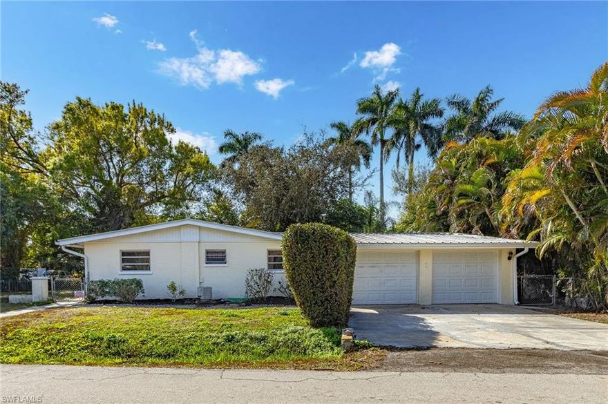 This old Florida-style home is nestled under huge shade trees and located on a dead-end road in a quiet neighborhood, with 3 bedrooms and two baths, and 1625 sq ft of living space. The front and back yards are fenced for your pets' pleasure. The seller has had the electrical service updated to code, and features include a metal roof, the original Terrazzo floors (looks like polished marble!), level 3 Black granite countertops, and stainless steel and black appliances. Both baths are remodeled, and the master has a beautiful custom Travertine tile floor and a large walk-in shower. The 3rd bedroom can also be used as a den. Garage has 2 new garage doors w/ openers and a workshop area.