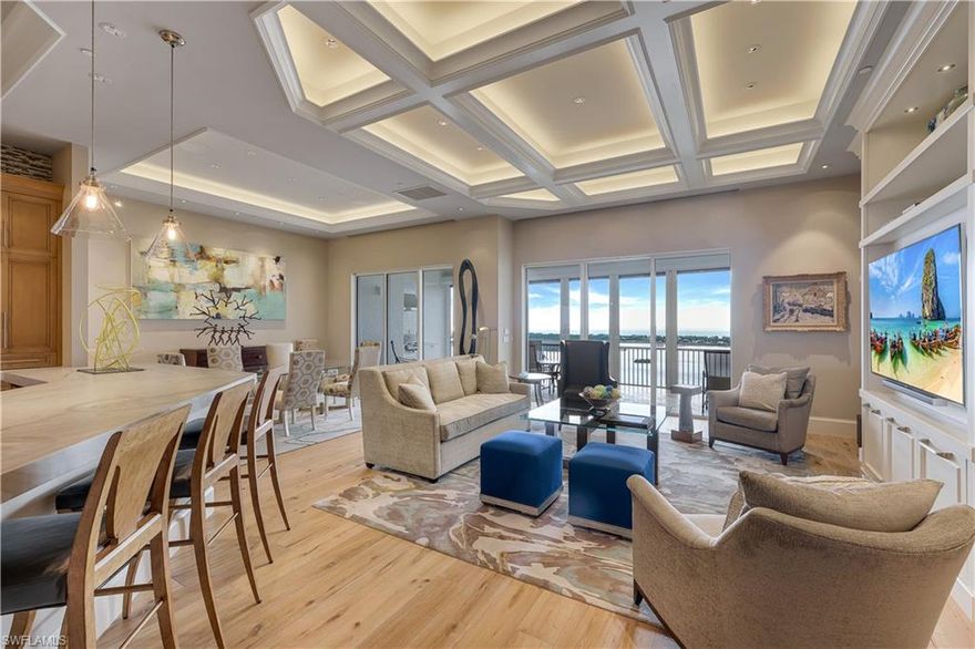 One of the most unique and stunning homes in all of Bonita Bay! ABSOLUTELY GORGEOUS w/esteemed PRIVATE 2 car garage - overlooking the Estero Bay & Gulf of Mexico! This home is pure sophistication & luxury! Located in the desirable Tavira high rise building, "move right in" to this exquisite home in the sky. This home's artistic owner lovingly designed the space - a true masterpiece! No expense was spared with the beautifully designed interior - from the ceiling details to the flooring to the state of the art kitchen. Addl features include handcrafted kitchen cabinets, quartz counter-tops, built in wine coolers,GORGEOUS lighting, VOLUME ceilings, custom shelving, split bedrooms,  several outdoor spaces & so much more. Entertain friends & family in this elegant (yet comfortable) home. This home is meant to be enjoyed - a true spiritual retreat! Tavira is one of Bonita Bay's most esteemed high rise buildings. Amenities include a beach park, nature trails, a marina & optional club membership including golf, tennis, several restaurants & fitness center. Do not hesitate as homes in Bonita Bay like this one RARELY become available! Be sure to view the accompanying video of this home!