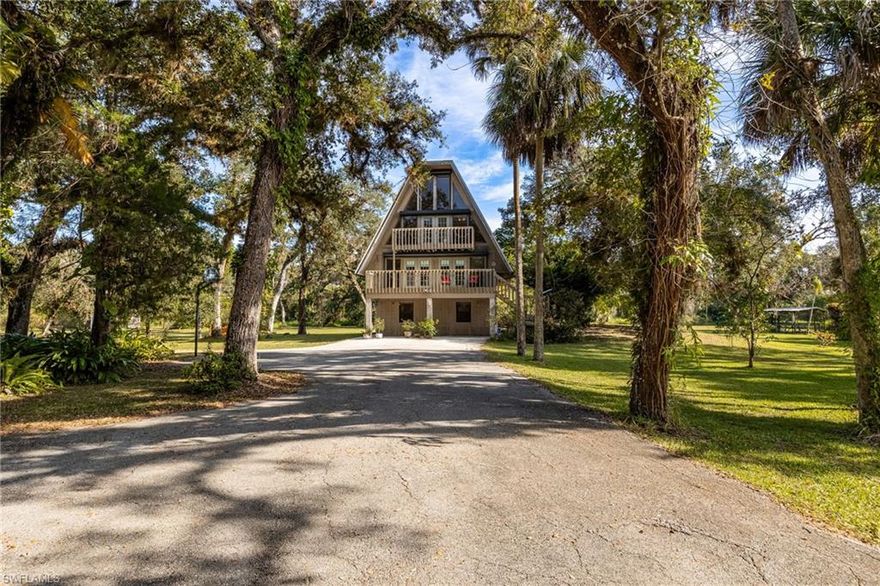 Nestled among beautiful oak trees, this enchanting four bedroom, three bathroom home sits on 10 acres and offers over 3,000 square feet of living space across three levels. A long private asphalt driveway off North River Road leads you to a residence full of personality and endless possibilities! With its serene setting and picturesque surroundings, this home makes you feel lost in the woods. At the same time, it is just minutes from the Caloosahatchee River, Caloosahatchee Park, The Alva School, and everything else the charming town of Alva has to offer!

The first floor features a private entry, two bedrooms, one bathroom, a cozy living room with a fireplace, and a kitchenette. It is ideal for a MIL suite, guest quarters, or even offers potential for rental income if desired. Upstairs, French doors at the top of the wooden staircase open to the main living, dining, and kitchen areas. The kitchen has ample cabinet and countertop space, stainless steel appliances, and allows you to enjoy the scenery while dining or unwinding on the sofa after a long day. The second floor also includes another bedroom and a dedicated laundry room. Two outdoor spaces provide peaceful spots to relax and take in sweeping views of the landscape. The third floor is a sun filled retreat with a loft, the primary suite, and two more balconies that highlight the natural beauty of the property! An added bonus: there are five electric roll-down shutters that help provide privacy and let you control the light throughout the home.

This residence includes numerous updates! The well was replaced in 2020. Second and third floor air conditioning units were replaced in 2022. The water heater was replaced in March 2025. The flat roof was replaced in 2017. Impact French doors were added by the kitchen in January 2025. The septic system was pumped in November 2025. The washer and dryer remain with the home. And power is set up for a 30-amp RV hookup.

Outside you can truly enjoy incredible views from every angle! The pond, privacy, and beautifully landscaped grounds create a serene, picture perfect setting. There is plenty of room for children to play or pets to explore! A detached workshop provides endless possibilities for hobbies, projects, or storing equipment. It also includes additional attic storage. You're sure to spend time lounging on one of the many balconies, wandering the property, or watching the local wildlife! This property perfectly blends charm, potential, and tranquility. A short 15 minute drive brings you to Babcock Ranch, where shopping, dining, and entertainment await! 

If you have been dreaming of a home that offers seclusion, personality, and 10 acres of natural beauty, this extraordinary Alva retreat is ready to welcome you home!