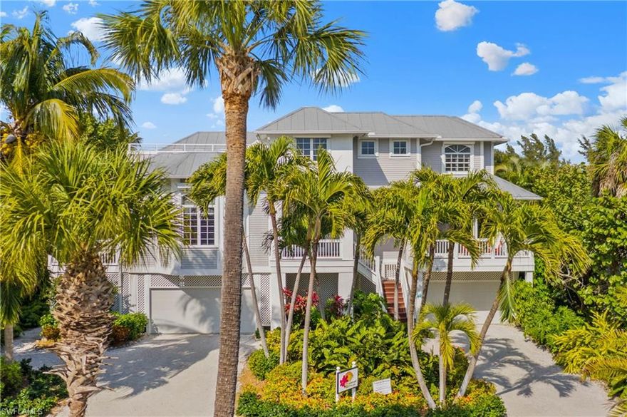 Colossal and impeccably maintained 5 bedroom/5 bath vacation retreat with partial Gulf of Mexico Views enveloped in over 10,000 total sq ft of expansive luxury only 60 yards from the beach on a private sandy lane boasting a lushly landscaped secluded 2 story screened pool and tiki bar complete with mood lighting for evening entertainment ambiance. 2 Master suites with jetted tubs and large enclosed walk-in showers and water closets. Arched doorways and soaring ceilings with coffered architectural definition. Tremendous light flowing through copious windows and glass doors. Multiple breezy decks to relax, dine, read a book or view the sunset from the expansive top floor sundeck. Spacious fully equipped Kitchen with piano bar island and 3 dining areas. Vibrant, colorful décor, 3 zone AC, Laundry on 2 floors, whole house music system, outdoor TV and much more. Short distance to Village eateries, shops and marinas. 5 star rated vacation rental with tremendous income. Rental website and private management set up to transition.