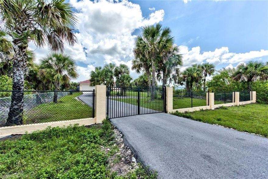 Privacy at its finest!  This 4BR 3BA home is nestled in the SE corridor off of Everglades Blvd.  With over 2100 sq ft of living space there is plenty of room for the entire family.   The kitchen features stainless steel appliances with granite counter tops, large living room area, and an eat in kitchen.  The 1.14 acre upland lot has plenty of room for all your toys, and offers a concrete patio off the screened in lanai for all your entertaining needs!  The entire property is fenced in and has a private wall with a gate at the entrance. Also, the home has just had a new tile roof installed in March of 2019.  No need to wait for new construction as this home is move in ready and available for a quick close!  Make your appointment today before its gone!